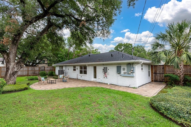 8932 Padfield St, Houston, TX 77055 - rear view of property featuring a patio area and brick siding