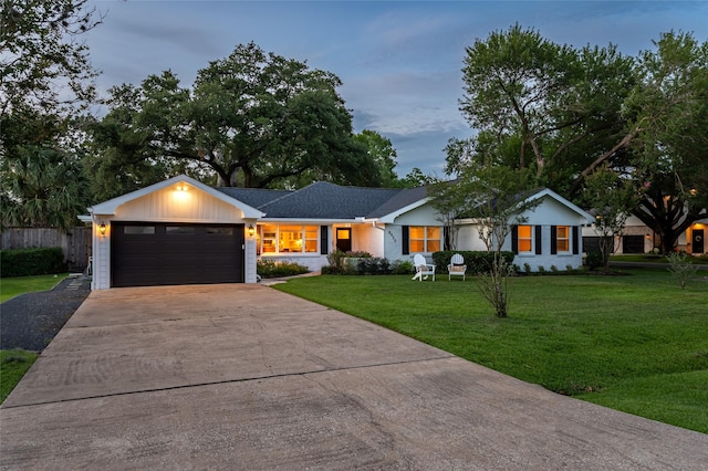 8932 Padfield St, Houston, TX 77055 - ranch-style house with a front yard, an attached garage, and concrete driveway