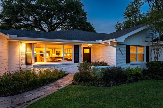 8932 Padfield St, Houston, TX 77055 - entrance to property with a lawn and brick siding