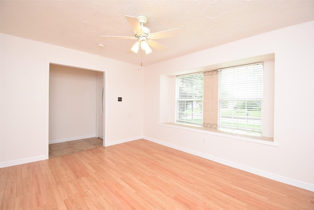 12006 Scottsdale Dr, Meadows Place, TX 77477 - unfurnished room with light wood-style floors and a ceiling fan