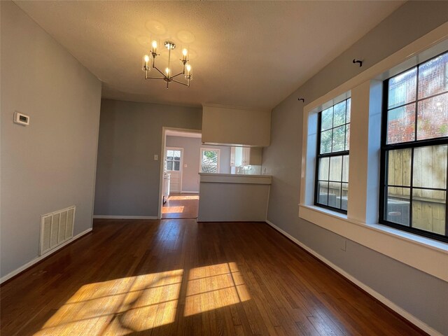 1805 Sul Ross St, Houston, TX 77098 - unfurnished living room with a chandelier and wood finished floors