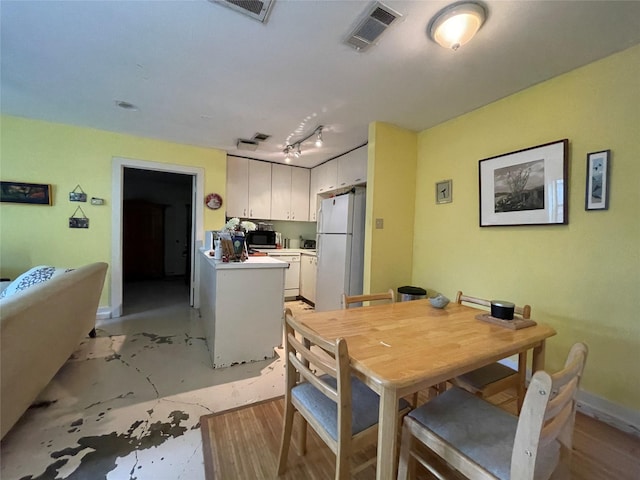 1805 Sul Ross St, Houston, TX 77098 - dining area with baseboards and track lighting