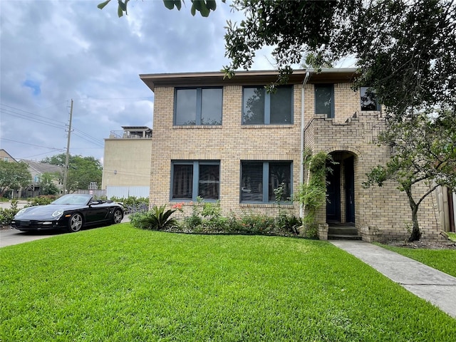 1805 Sul Ross St, Houston, TX 77098 - view of front facade with a front yard and brick siding