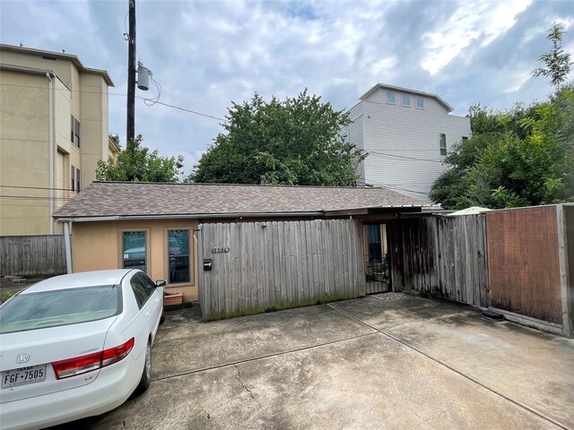 1805 Sul Ross St, Houston, TX 77098 - view of home's exterior featuring roof with shingles and a patio area