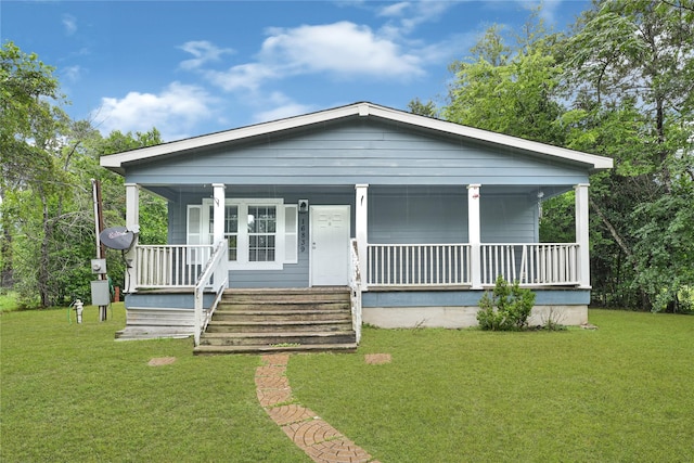 16839 Yates St, Splendora, TX 77372 - view of front of house featuring a porch and a front lawn