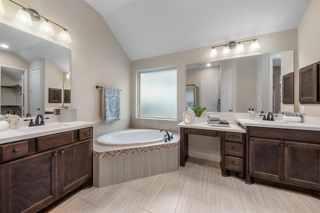 1504 Moreland Park Ct, Friendswood, TX 77546 - full bath featuring lofted ceiling, a garden tub, two vanities, and a stall shower