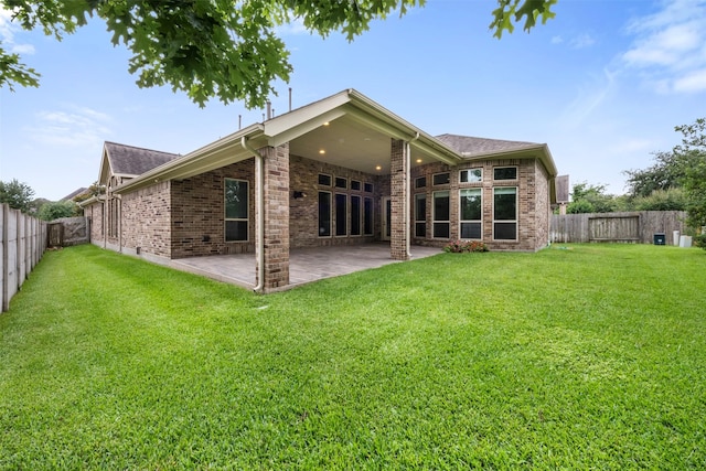 1504 Moreland Park Ct, Friendswood, TX 77546 - back of house with brick siding, a fenced backyard, a patio, and a shingled roof