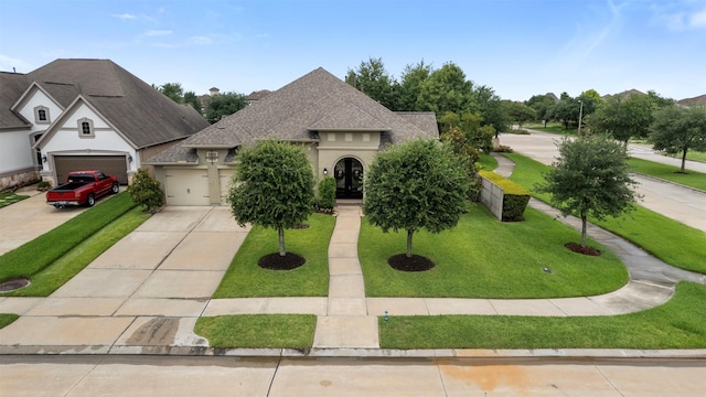 1504 Moreland Park Ct, Friendswood, TX 77546 - view of front of property with concrete driveway, a shingled roof, an attached garage, and a front lawn