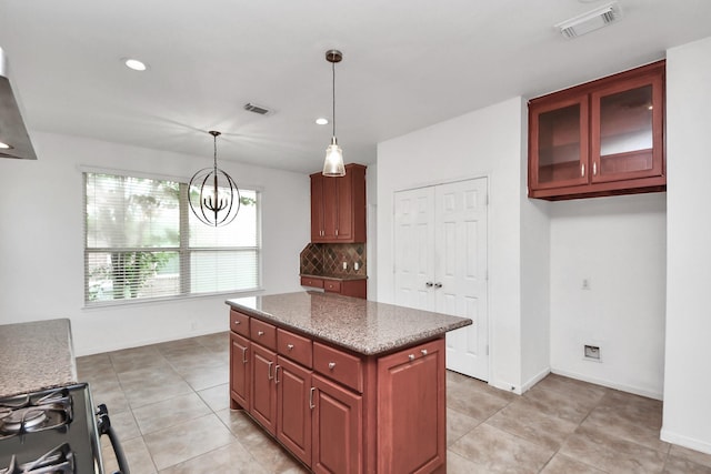 2508 Sun Glen Dr, Pearland, TX 77584 - kitchen featuring decorative backsplash, decorative light fixtures, a chandelier, a kitchen island, and recessed lighting