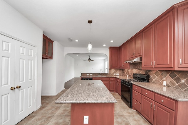 2508 Sun Glen Dr, Pearland, TX 77584 - kitchen featuring black gas stove, under cabinet range hood, ceiling fan, light tile patterned floors, and recessed lighting