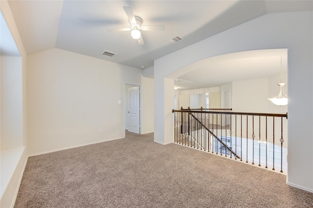 7615 Adobe Canyon Ln, Richmond, TX 77469 - unfurnished room featuring a ceiling fan, vaulted ceiling, arched walkways, and carpet
