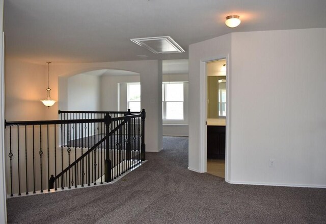 7615 Adobe Canyon Ln, Richmond, TX 77469 - hall featuring attic access, carpet flooring, an upstairs landing, and arched walkways