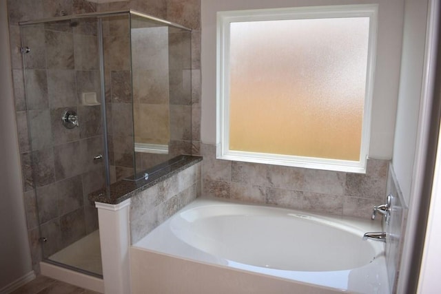 7615 Adobe Canyon Ln, Richmond, TX 77469 - bathroom with a garden tub and a stall shower