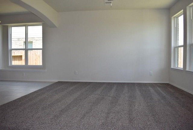 7615 Adobe Canyon Ln, Richmond, TX 77469 - carpeted spare room featuring arched walkways and tile patterned flooring
