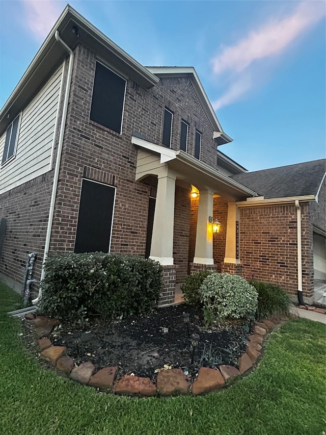 7615 Adobe Canyon Ln, Richmond, TX 77469 - view of front of house featuring brick siding, a front yard, and an attached garage