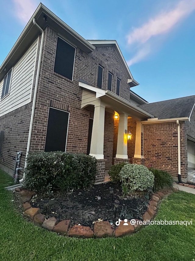 7615 Adobe Canyon Ln, Richmond, TX 77469 - traditional-style house featuring brick siding and an attached garage