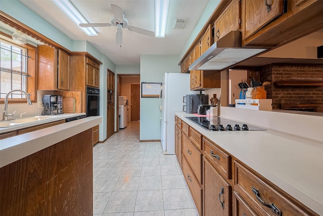 327 Edgeton Ct, Houston, TX 77015 - kitchen featuring black appliances, under cabinet range hood, brown cabinetry, and ceiling fan