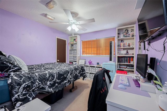 327 Edgeton Ct, Houston, TX 77015 - carpeted bedroom with a textured ceiling and ceiling fan