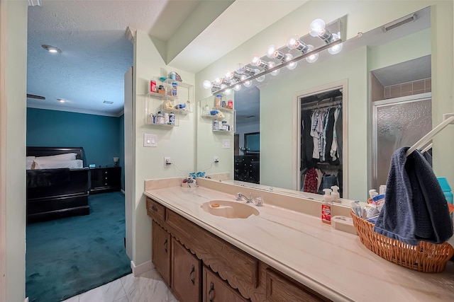 327 Edgeton Ct, Houston, TX 77015 - full bath featuring vanity, a walk in closet, a shower with shower door, ornamental molding, and ensuite bathroom
