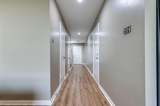 8206 Bassett St, Houston, TX 77051 - corridor with light wood finished floors and recessed lighting