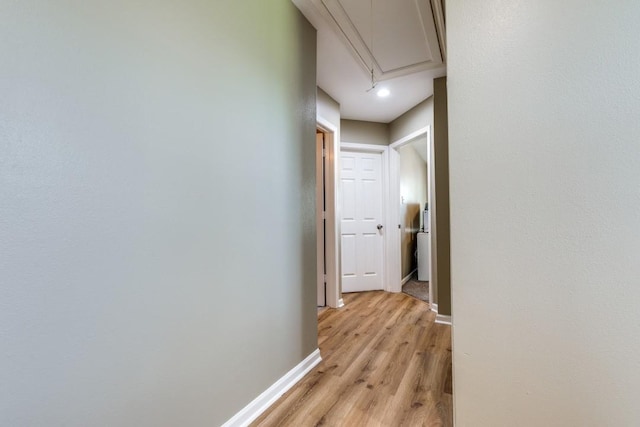 8206 Bassett St, Houston, TX 77051 - hall featuring attic access and light wood-type flooring