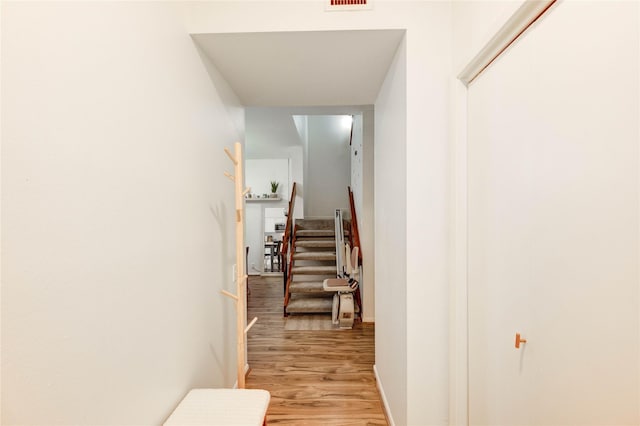 1572 Prairie Grove Dr, Houston, TX 77077 - corridor featuring light wood-style floors and stairway
