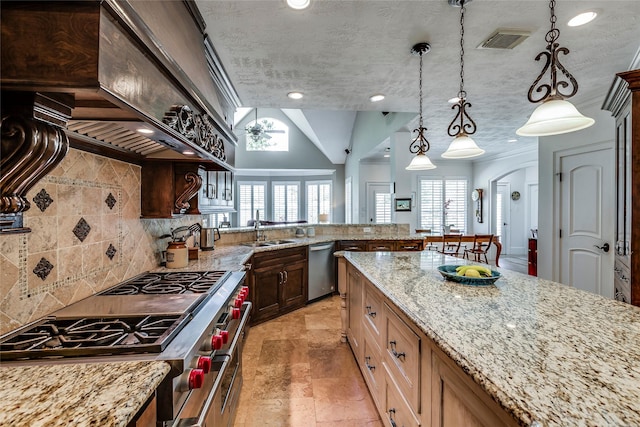 12042 Bolero Point Ln, Houston, TX 77041 - kitchen featuring appliances with stainless steel finishes, tasteful backsplash, light stone countertops, pendant lighting, and recessed lighting