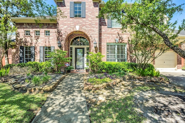 12042 Bolero Point Ln, Houston, TX 77041 - view of front facade with brick siding, an attached garage, and concrete driveway