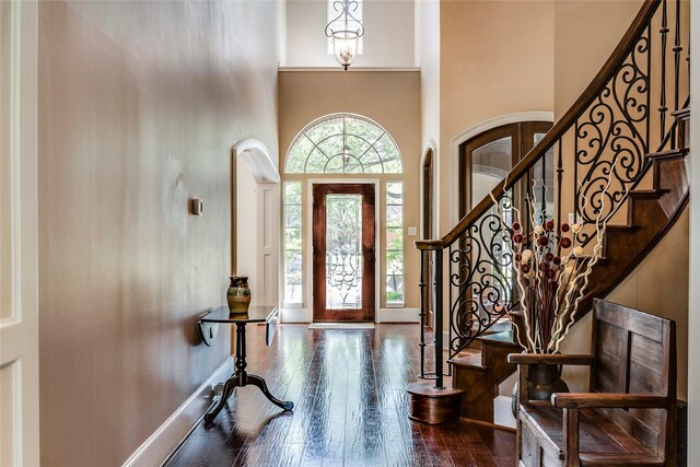 12042 Bolero Point Ln, Houston, TX 77041 - entrance foyer featuring dark wood-style floors, a high ceiling, and stairs