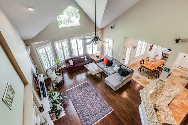 12042 Bolero Point Ln, Houston, TX 77041 - living room featuring high vaulted ceiling, ceiling fan, and wood finished floors