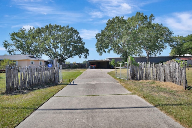 29515 Quinn Rd, Tomball, TX 77375 - view of front of property with concrete driveway and a gate