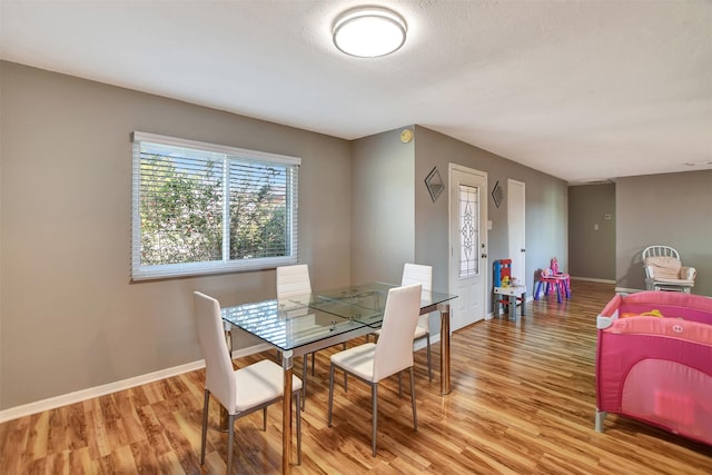 29515 Quinn Rd, Tomball, TX 77375 - dining room with light wood-style flooring and baseboards