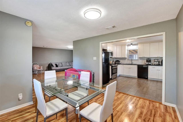 29515 Quinn Rd, Tomball, TX 77375 - dining room with wood finished floors and baseboards