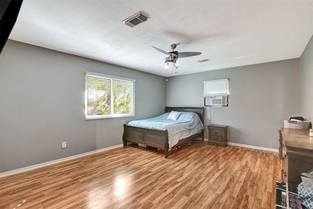 29515 Quinn Rd, Tomball, TX 77375 - bedroom with light wood-style flooring, ceiling fan, and cooling unit