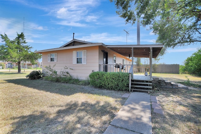 29515 Quinn Rd, Tomball, TX 77375 - view of front facade featuring a deck and a front lawn