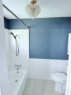 10302 Sageplum Dr, Houston, TX 77089 - bathroom featuring wainscoting, tile patterned floors, and shower / tub combination