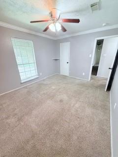 10302 Sageplum Dr, Houston, TX 77089 - unfurnished bedroom featuring ornamental molding, carpet floors, and a ceiling fan