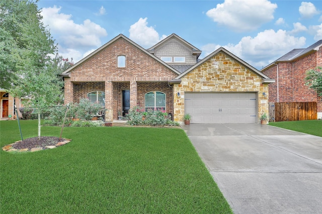 6507 Crystal Forest Trl, Katy, TX 77493 - view of front facade with an attached garage, driveway, stone siding, and brick siding