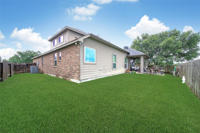 6507 Crystal Forest Trl, Katy, TX 77493 - rear view of property featuring brick siding, a fenced backyard, and a patio