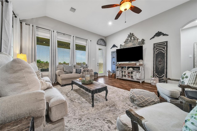 6507 Crystal Forest Trl, Katy, TX 77493 - living room featuring wood finished floors, ceiling fan, arched walkways, lofted ceiling, and recessed lighting