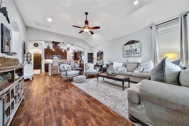 6507 Crystal Forest Trl, Katy, TX 77493 - living area featuring arched walkways, vaulted ceiling, ceiling fan, dark wood-style flooring, and recessed lighting