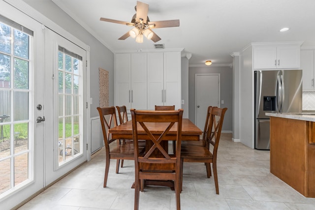 13411 Naples Bridge Rd, Sugar Land, TX 77498 - dining room with crown molding, french doors, ceiling fan, light tile patterned flooring, and recessed lighting