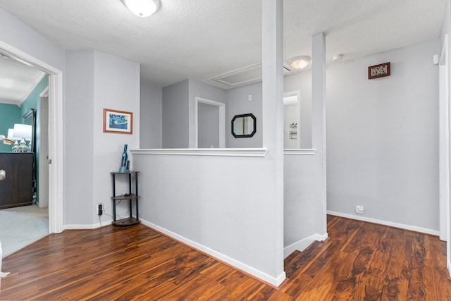 13411 Naples Bridge Rd, Sugar Land, TX 77498 - corridor with attic access, wood finished floors, an upstairs landing, and a textured ceiling