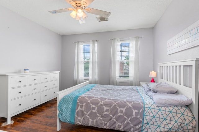 13411 Naples Bridge Rd, Sugar Land, TX 77498 - bedroom with dark wood finished floors and ceiling fan