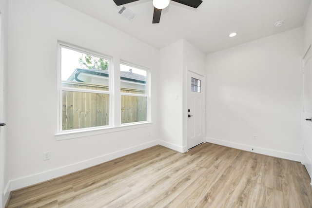 3453 Mainer St, Houston, TX 77021 - spare room featuring ceiling fan and light wood-style flooring