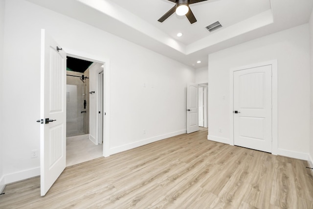 3453 Mainer St, Houston, TX 77021 - unfurnished bedroom featuring light wood-type flooring, recessed lighting, a raised ceiling, and ensuite bath