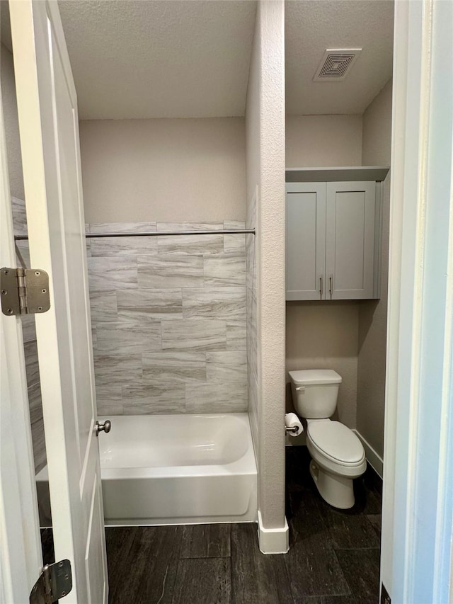 14912 Diamondhead Rd, Conroe, TX 77356 - full bath with wood finished floors, a textured ceiling, and shower / bath combination