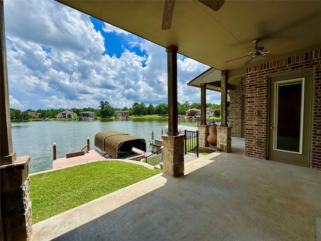 14912 Diamondhead Rd, Conroe, TX 77356 - view of patio / terrace featuring a water view, ceiling fan, and a dock