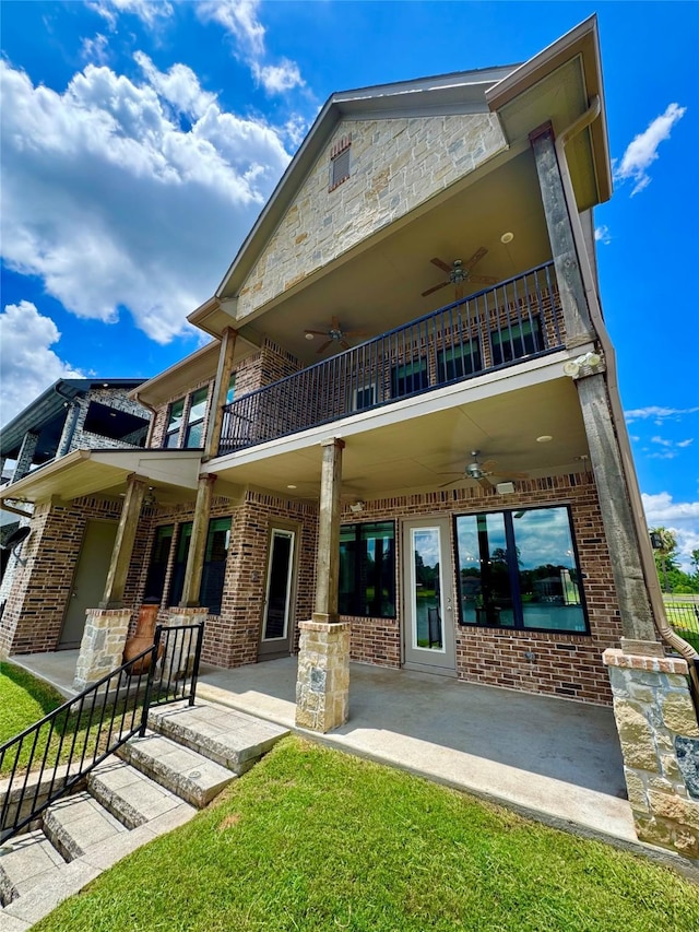 14912 Diamondhead Rd, Conroe, TX 77356 - rear view of property featuring a balcony, ceiling fan, brick siding, and a patio area