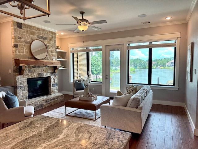 14912 Diamondhead Rd, Conroe, TX 77356 - living area featuring a ceiling fan, dark wood-type flooring, crown molding, and a fireplace